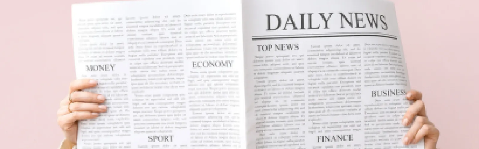 person holding newspaper